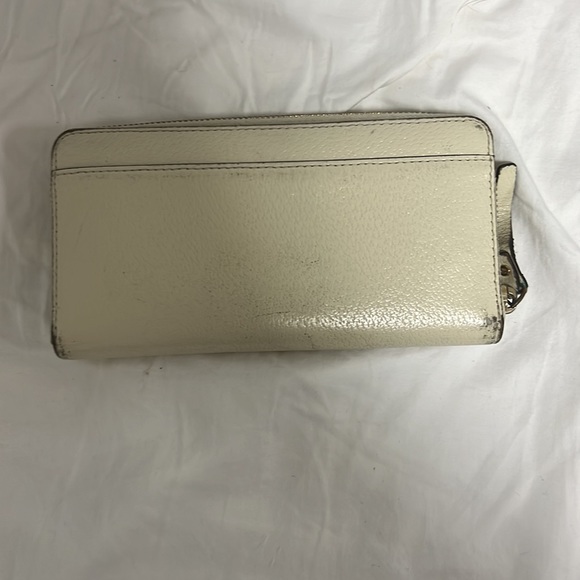 Beige Kate spade large zip around wallet. All damage is shown in pictures. - Picture 4 of 6